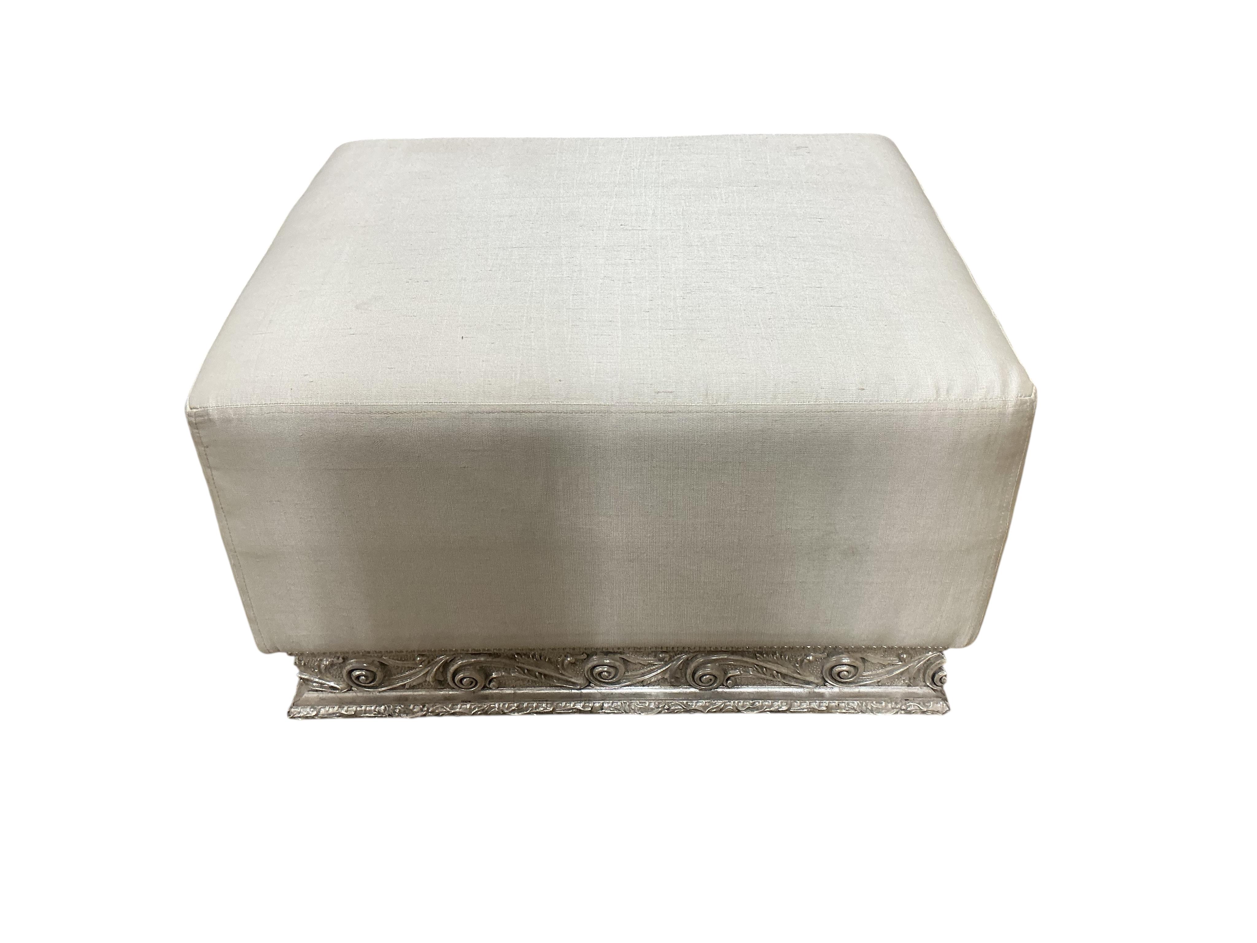 A pair of contemporary ivory fabric and silvered wood stools, width 70cm, depth 60cm, height 44cm